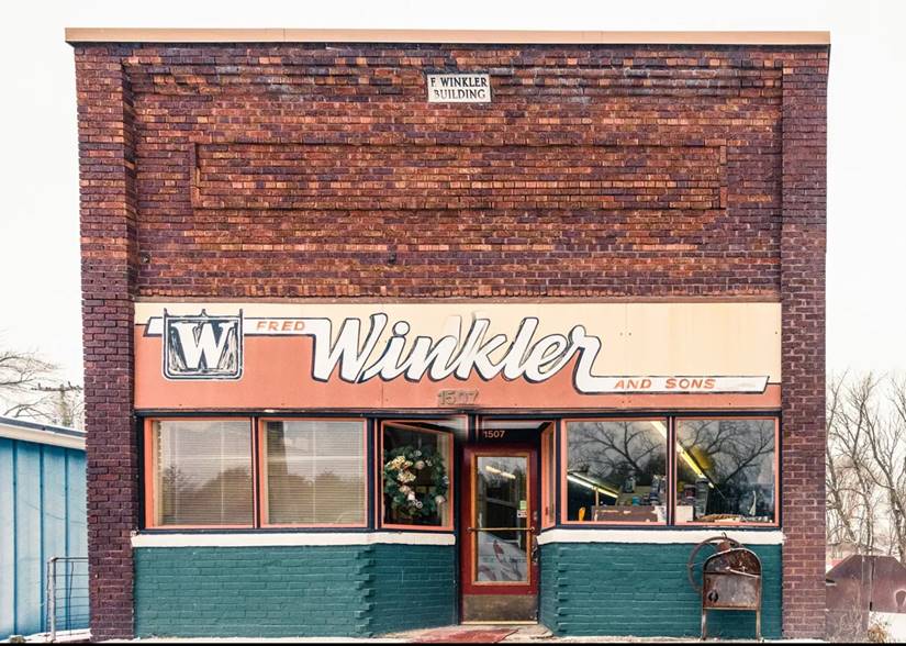 The Winkler & Sons brick storefront with its painted Winkler sign